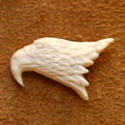 View a larger carved antler tie tack by Bill Jons